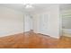 Light-filled bedroom with hardwood floors and a ceiling fan offers ample space and closet storage at 693 Mallard Lake Dr., Myrtle Beach, SC 29577