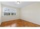 Bright bedroom featuring wood floors and a large window for ample natural light at 693 Mallard Lake Dr., Myrtle Beach, SC 29577