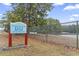 City of Myrtle Beach Dog Parks sign with a chain link fence and a view of the lake in the background at 693 Mallard Lake Dr., Myrtle Beach, SC 29577