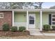 Close-up of the inviting home entrance with a cozy porch and decorative lattice details at 693 Mallard Lake Dr., Myrtle Beach, SC 29577