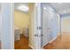 Hall view of laundry room with washer and dryer, and wood floors at 693 Mallard Lake Dr., Myrtle Beach, SC 29577