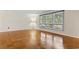 Cozy living room featuring large window with wood floors and natural light at 693 Mallard Lake Dr., Myrtle Beach, SC 29577