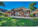 Beautiful backyard featuring a patio with outdoor seating, surrounded by lush green grass at 702 Compass Point Dr., North Myrtle Beach, SC 29582