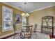 Bright dining area with stylish chandelier and views to the outside at 702 Compass Point Dr., North Myrtle Beach, SC 29582