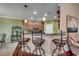 Dining area showcasing a stylish bar and pendant lighting at 702 Compass Point Dr., North Myrtle Beach, SC 29582