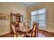 Formal dining room featuring a wooden table, elegant chairs, and decorative accents at 702 Compass Point Dr., North Myrtle Beach, SC 29582