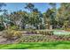 Community entrance featuring lush landscaping, water feature and beautiful signage at 702 Compass Point Dr., North Myrtle Beach, SC 29582