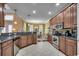 Well-equipped kitchen with wooden cabinets, stainless steel appliances, and granite countertops at 702 Compass Point Dr., North Myrtle Beach, SC 29582