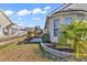 Landscaped backyard featuring a well-maintained lawn, patio area, and tasteful plantings at 7228 Guinevere Circle, Myrtle Beach, SC 29588