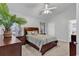 Cozy bedroom with a large bed, ceiling fan, and lots of natural light at 7228 Guinevere Circle, Myrtle Beach, SC 29588