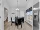 Bright dining area with wood-look floors and views of the outside at 7228 Guinevere Circle, Myrtle Beach, SC 29588