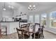 Dining area features wood floors, chandelier lighting, and lots of natural light at 7228 Guinevere Circle, Myrtle Beach, SC 29588