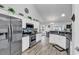 Bright kitchen featuring stainless steel appliances and white cabinets at 7228 Guinevere Circle, Myrtle Beach, SC 29588