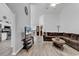 Inviting living room with vaulted ceilings, wood flooring, and comfortable seating at 7228 Guinevere Circle, Myrtle Beach, SC 29588