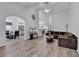 Open-concept living room featuring wood floors and an archway to the dining area at 7228 Guinevere Circle, Myrtle Beach, SC 29588