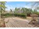 Wide shot of the deck surrounded by greenery and a view of the trees behind the house at 800 Egret Circle # 34, Little River, SC 29566