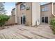 Back exterior featuring multiple sliding glass doors leading to a wood deck and small trees at 800 Egret Circle # 34, Little River, SC 29566