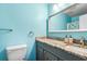 Bathroom featuring gray vanity with granite countertop and light blue walls at 800 Egret Circle # 34, Little River, SC 29566