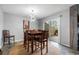 Dining room with wood table and chairs set upon a round rug, and a sliding glass door at 800 Egret Circle # 34, Little River, SC 29566