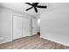 Bedroom featuring modern ceiling fan, double closet, and light gray walls at 817 Riverwood Ct., Little River, SC 29566