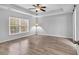 Bright bedroom with a ceiling fan and natural light from a large window at 817 Riverwood Ct., Little River, SC 29566