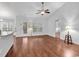 Bright and airy living area with hardwood floors, large windows, and access to the backyard at 817 Riverwood Ct., Little River, SC 29566