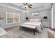 Beautiful main bedroom with tray ceiling, a ceiling fan and large window at 817 Riverwood Ct., Little River, SC 29566