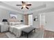 Beautiful main bedroom with tray ceiling, barn door to bathroom and doorway to walk in closet at 817 Riverwood Ct., Little River, SC 29566