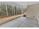 Screened porch with view of wooded backyard at 817 Riverwood Ct., Little River, SC 29566