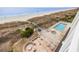 Beautiful aerial view of the community, including the pool, beach, and surrounding landscape at 817 S Ocean Blvd. # 105, North Myrtle Beach, SC 29582
