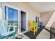 Relaxing balcony featuring colorful Adirondack chairs and ocean views at 817 S Ocean Blvd. # 105, North Myrtle Beach, SC 29582