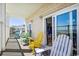 Balcony featuring colorful adirondack chairs overlooking the beach at 817 S Ocean Blvd. # 105, North Myrtle Beach, SC 29582