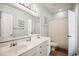 Bright bathroom with double sink vanity, large mirror, and shower with a white curtain at 817 S Ocean Blvd. # 105, North Myrtle Beach, SC 29582