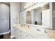 Well-lit bathroom boasts a dual sink vanity and neutral color palette at 817 S Ocean Blvd. # 105, North Myrtle Beach, SC 29582