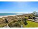 Stunning beach view from a high vantage point, with a path leading to the sandy shore at 817 S Ocean Blvd. # 105, North Myrtle Beach, SC 29582