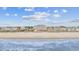 Picturesque beachfront view of the ocean and coastline, showcasing nearby buildings at 817 S Ocean Blvd. # 105, North Myrtle Beach, SC 29582