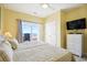 Bedroom featuring a bed, balcony, and white dresser at 817 S Ocean Blvd. # 105, North Myrtle Beach, SC 29582