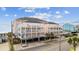 Three-story beachfront condo featuring multiple balconies and covered parking at 817 S Ocean Blvd. # 105, North Myrtle Beach, SC 29582