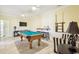 Spacious game room featuring a pool table, lounge area, and nautical-themed decor at 817 S Ocean Blvd. # 105, North Myrtle Beach, SC 29582