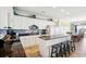Spacious kitchen with granite countertops, breakfast bar, and white cabinetry at 817 S Ocean Blvd. # 105, North Myrtle Beach, SC 29582
