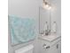 Bright powder room featuring a vanity with a white countertop and nautical accents at 89 Enclave Pl., Pawleys Island, SC 29585