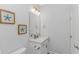 Cozy powder room featuring framed starfish art and neutral decor at 89 Enclave Pl., Pawleys Island, SC 29585