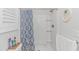 Bright bathroom featuring a shower with decorative blue patterned curtain and beach themed decorations at 89 Enclave Pl., Pawleys Island, SC 29585