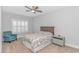 Comfortable bedroom with a ceiling fan, plantation shutters, and a cozy armchair at 89 Enclave Pl., Pawleys Island, SC 29585