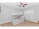 Comfortable bedroom featuring a bunk bed, carpet, and natural light at 89 Enclave Pl., Pawleys Island, SC 29585