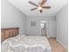 Relaxing bedroom with a ceiling fan and a glimpse of an ensuite bathroom at 89 Enclave Pl., Pawleys Island, SC 29585