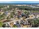 Aerial view of the neighborhood, featuring mature trees, landscaping, and a mix of home styles at 900 Berwick Ln., Myrtle Beach, SC 29579