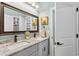 Bathroom with double sinks, framed mirror, and vanity with stone counters at 900 Berwick Ln., Myrtle Beach, SC 29579