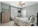 This bedroom features a ceiling fan, a window with shutters, and a closet at 900 Berwick Ln., Myrtle Beach, SC 29579