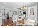 Casual dining area with open access to the kitchen, modern furnishings, and ample natural light at 900 Berwick Ln., Myrtle Beach, SC 29579